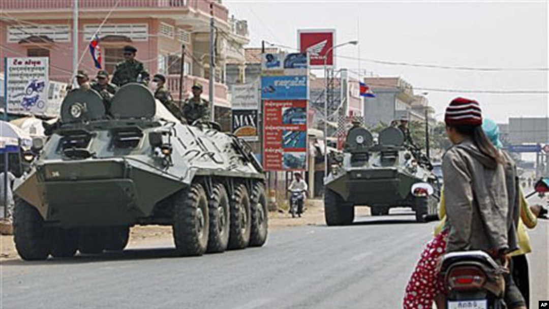 Armored personnel carriers of Cambodian Army drive through a road at Kampong Thom town, about 168 kilometers north of Phnom Penh, Cambodia - neighboring province to Preah Vihear of disputed 11th century Hindu Preah Vihear temple near border between Cambod