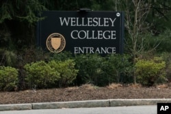 FILE - The entrance to Wellesley College in Wellesley, Mass., is pictured on April 20, 2020. The school is one of the most costly in the U.S. (AP Photo/Charles Krupa, File)