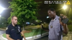 FILE - This screen grab taken from body camera video provided by the Atlanta Police Department shows Rayshard Brooks speaking with Officer Garrett Rolfe in the parking lot of a Wendy's restaurant in Atlanta, late Friday, June 12, 2020.