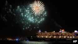 The Queen Mary 2 cruise ship is seen near a fireworks display January 13, 2011 in New York City.