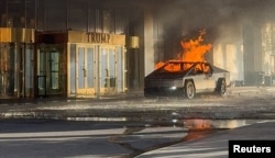 Flames rise from a Tesla Cybertruck after it exploded outside the Trump International Hotel Las Vegas, in Las Vegas, Nevada, Jan. 1, 2025 in this screengrab taken from a social media video. ( Antunes via Reuters)