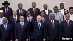 FILE - Russia's President Vladimir Putin waves during a photo with heads of countries taking part in the 2019 Russia-Africa Summit at the Sirius Park of Science and Art in Sochi, Russia, Oct. 24, 2019. 