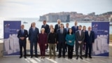 In this handout photograph taken and released by the Ukrainian Presidential Press Service on October 9, 2024, (L-R 1st row) Greece's Prime Minister Kyriakos Mitsotakis, Serbia's President Aleksandar Vucic, Slovenia's President Natasa Pirc Musar, Ukraine's