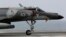 FILE - A French military plane lands on the French navy aircraft carrier Charles de Gaulle in the Persian Gulf.
