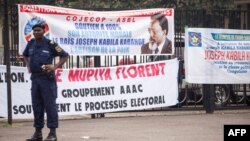 Banners in support of President of the Democratic Republic of Congo, Joseph Kabila are seen outside parliament, where the president holds his state-of-the-nation speech, in Kinshasa on July 19, 2018.