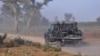 FILE - Members of the Cameroonian Rapid Intervention Battalion patrol on the outskirts of Mosogo in the far north region of the country, March 21, 2019.