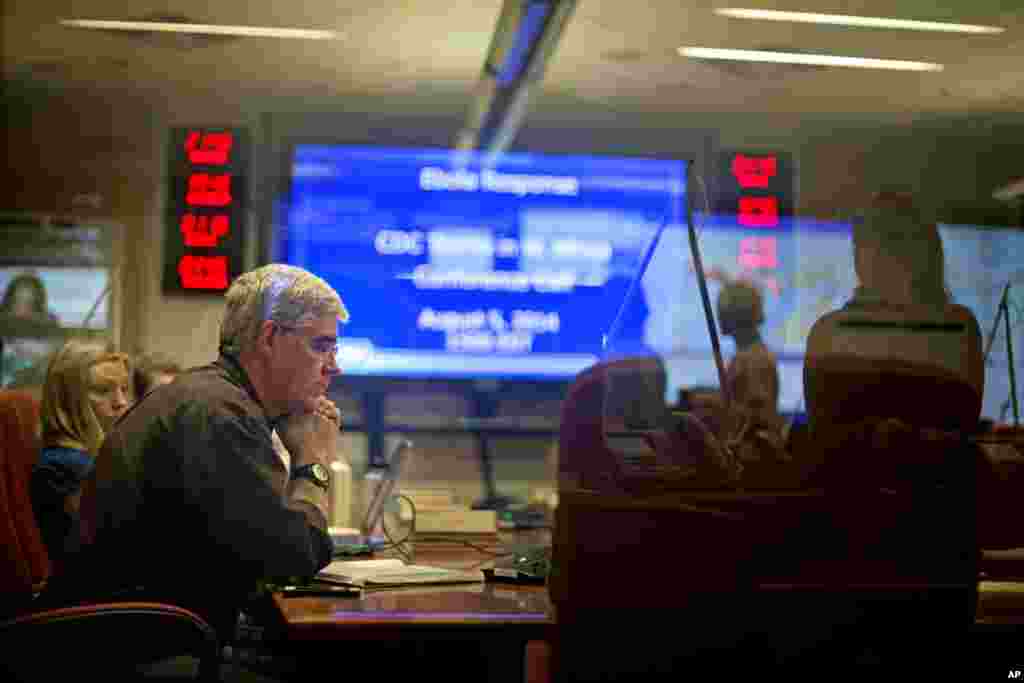 At the U.S. Centers for Disease Control and Prevention officials are on a conference call with CDC team members deployed in West Africa from the agency&#39;s Emergency Operations Center, Aug. 5, 2014, in Atlanta.