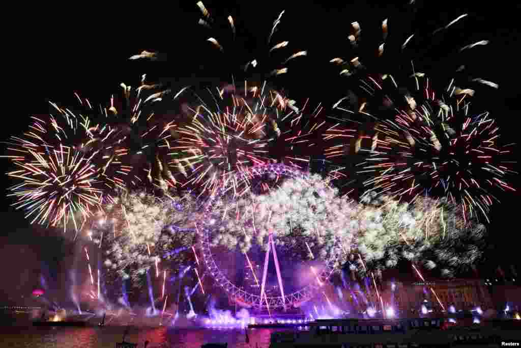 Fireworks explode over the London Eye Ferris wheel as Britons across the country welcome the New Year, in London, Jan. 1, 2025.