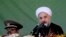Iran's President Hassan Rouhani, gives a speech during an annual military parade in Tehran on Sept, 22, 2013. 