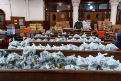 Food packages are organized at Evangel Church in Long Island City, to be distributed by New York Cares volunteers to those in need. (Photo courtesy New York Cares)