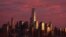 FILE - The setting sun reflects off of One World Trade Center and surrounding buildings at sunset in the Manhattan borough of New York City, Nov. 22, 2015. 