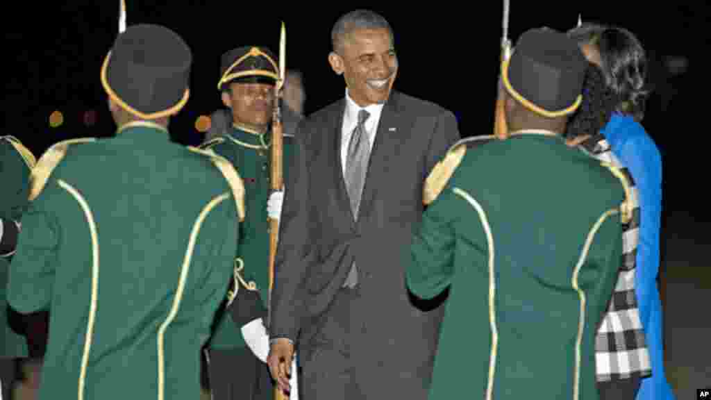 President Barack Obama and first lady Michelle Obama arrive at Waterkloof Air Base in Centurion, South Africa, June 28, 2013.