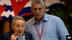 FILE - Cuba's President Raul Castro, left, gestures as he stands with Vice President Miguel Diaz Canel during the 7th Cuban Communist Party Congress in Havana, Cuba, April 16, 2016. 