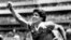 FILE - Argentinian star Diego Maradona raises his arm in the air after scoring his game-winning goal against England in their World Cup semi final in Mexico, June 22, 1986. 
