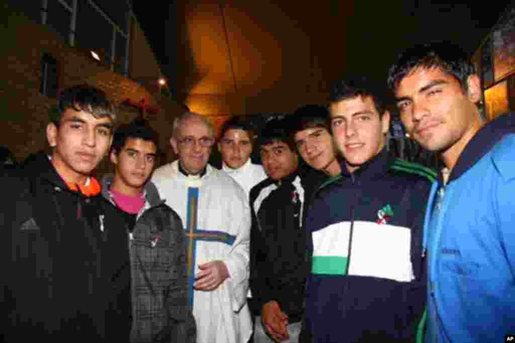Argentina&#39;s Cardinal Jorge Bergoglio, third from left, poses with young players of the San Lorenzo soccer team inside the soccer club&#39;s chapel in Buenos Aires, March 24, 2011. Bergoglio was chosen as Pope on March 13, 2013, the first pope ever from the Americas and the first from outside Europe in more than a millenium.&nbsp;(AP Photo/Club Atletico San Lorenzo de Almagro)