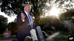 FILE - President Donald Trump talks with reporters on the South Lawn of the White House in Washington, Aug. 30, 2019, en route to Camp David in Maryland. 