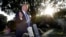 FILE - President Donald Trump talks with reporters on the South Lawn of the White House in Washington, Aug. 30, 2019, en route to Camp David in Maryland. 