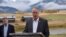 FILE - U.S. Interior Secretary Ryan Zinke announces a ban on mining claims north of Yellowstone National Park as K.C. Walsh, left, president of Simms Fishing Products, listens near Emigrant, Mont., Oct. 8, 2018.