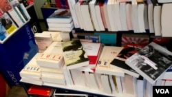 A selection of this fall's novels is stacked at L'Alba bookstore in the French town of Ile Rousse. (L. Bryant/VOA)