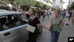 (Photo d'archives) Des gens participent à une manifestation en solidarité avec les Palestiniens de Gaza, dans le centre-ville d'Alger, le vendredi 13 octobre 2023. (AP Photo/Fateh Guidoum)