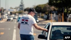 FILE—Cape Independence Party (CapeXit) volunteers and agents hand out flyers and campaigning material at a party campaign point in Cape Town on March 2, 2024.