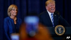 President Donald Trump, joined by Rep. Claudia Tenney, R-N.Y., speaks in Utica, N.Y., Monday, Aug. 13, 2018, at a joint fundraising committee reception in Utica, N.Y.