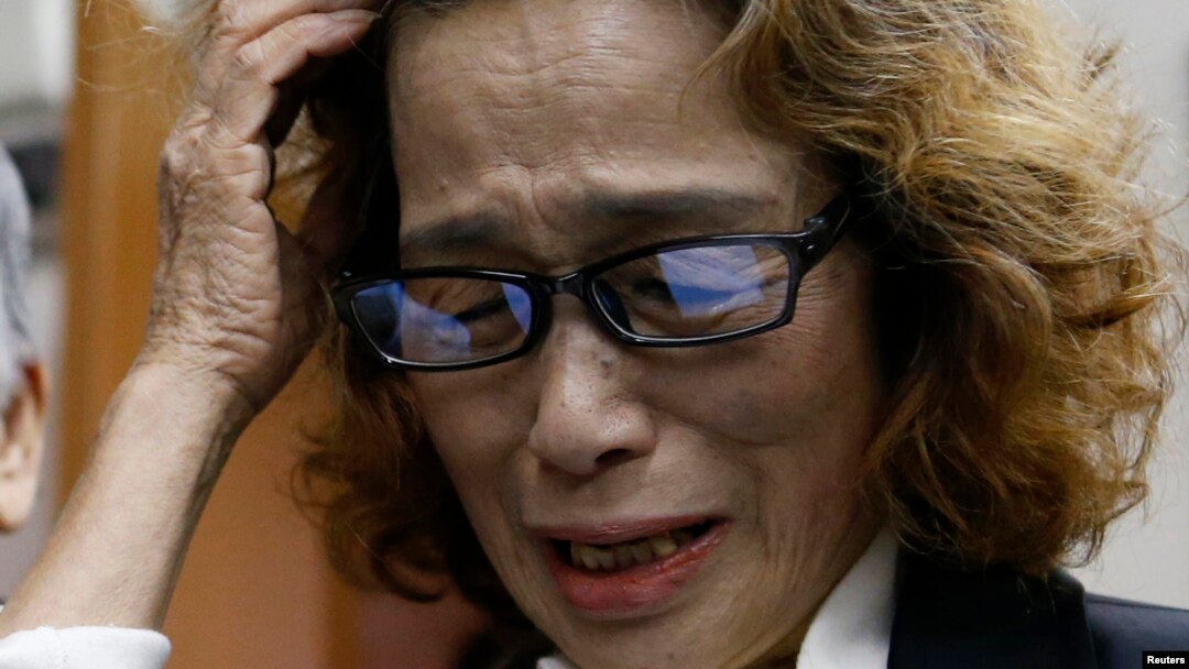 FILE - Junko Ishido, mother of Japanese journalist Kenji Goto who was slain by Islamic State militants, speaks to reporters at her house in Tokyo, Feb. 1, 2015. 