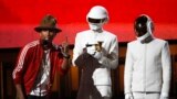 Pharrell Williams accepts the award for record of the year for Daft Punk for "Get Lucky" at the 56th annual Grammy Awards in Los Angeles, Jan. 26, 2014. 