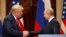 US President Donald J. Trump (L) and Russian President Vladimir Putin (R) shake hands during a joint press conference following their summit talks at the Presidential Palace in Helsinki, Finland, July 16, 2018 