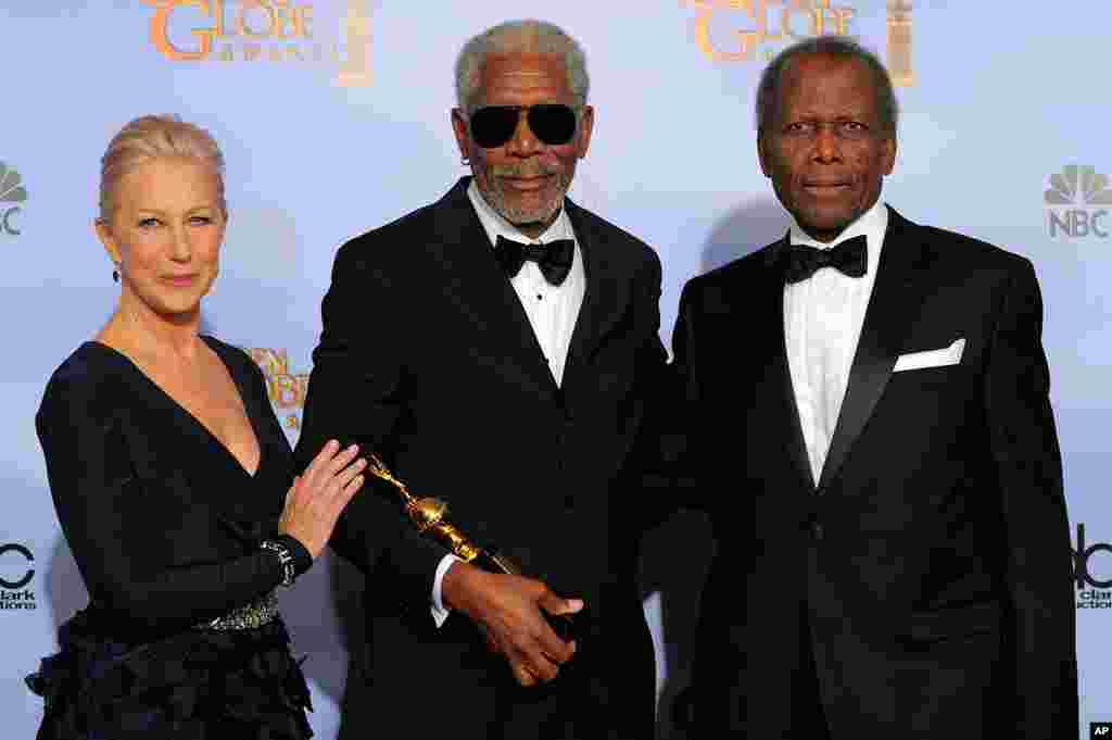 Actor Morgan Freeman, center, poses backstage with the Cecil B. Demille Award with Helen Mirren, left, and Sidney Poitier, right, during the 69th Annual Golden Globe Awards on January 15, 2012, in Los Angeles. (AP)