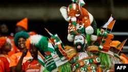 FILE — Ivorian supporter gestures ahead of the 2023 Africa Cup of Nations semi-final between Ivory Coast and Democratic Repuplic of Congo at Alassane Ouattara Olympic Stadium in Ebimpe, Abidjan on February 7, 2024.