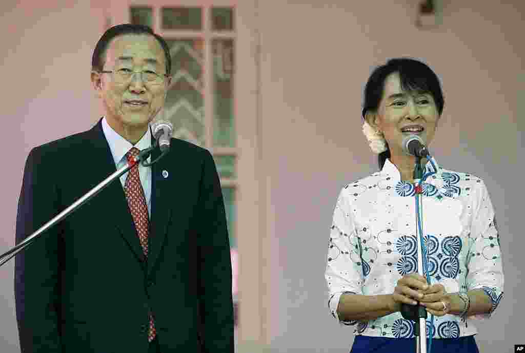 Burmese pro-democracy leader Aung San Suu Kyi  talks to reporters after meeting with United Nations Secretary-General Ban Ki-moon at her house in Rangoon, May 1, 2012. (Reuters)