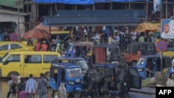 Armed Forces of the Democratic Republic of the Congo (FARDC) soldiers get into a vehicle in Bukavu on February 14, 2025.