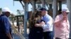 President Joe Biden hugs a person in Keaton Beach, Florida, during his tour of areas impacted by Hurricane Helene, Oct. 3, 2024. 