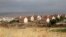 FILE - Houses are seen in the West Bank Jewish settlement of Karmel, near Hebron, May 24, 2016. 