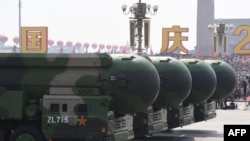 FILE - This file photo taken on Oct. 1, 2019 shows China's DF-41 nuclear-capable intercontinental ballistic missiles during a military parade at Tiananmen Square in Beijing