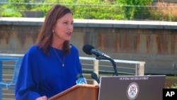 Michigan Gov. Gretchen Whitmer speaks at Rotary Park along the Grand River in Lansing, Mich., Aug. 23, 2021.