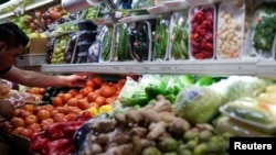 FILE PHOTO: A person arranges groceries in El Progreso Market in the Mount Pleasant neighborhood of Washington, D.C., U.S. on August 19, 2022. (REUTERS/Sarah Silbiger/File Photo)