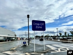 A sign for the drop-off area is displayed at the Dunedin airport in Momona, New Zealand, Oct. 8, 2024. (Sarah Soper/Dunedin Airport via AP)