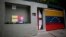 A banner with the image of opposition leader Leopoldo Lopez stands outside of his home in Caracas, Venezuela, Aug. 1, 2017.