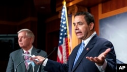 FILE - Rep. Henry Cuellar, D-Texas, speaks during a news conference at the Capitol in Washington, July 30, 2021.