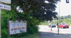 A campaign poster of far-right regional candidate Julien Odoul with party leader Marine Le Pen outside Montbeliard, in eastern France. (Lisa Bryant/VOA)