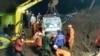 An ambulance is lifted after it was buried in a landslide in Sumedang, West Java, Indonesia, Jan. 9, 2021, in this still image taken from a video obtained from social media. (Rescue Motor Indonesia/via Reuters)