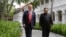 FILE - U.S. President Donald Trump and North Korea leader Kim Jong Un walk from their lunch at the Capella resort on Sentosa Island in Singapore, June 12, 2018. 