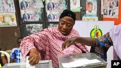 Women cast their votes during a local government election in Nigeria's commercial capital Lagos October 22, 2011.