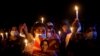 Para demonstran memegang lilin selama protes malam nasional menentang kudeta militer di Mandalay, Myanmar 12 Maret 2021. (Foto: Reuters)