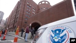 FILE - A Homeland Security vehicle outside the Moakley Federal Courthouse in Boston. A citizen of China who is a student at the Berklee College of Music was convicted Jan. 25, 2024, of threatening a person who posted a flyer in support of democracy in China, authorities said.