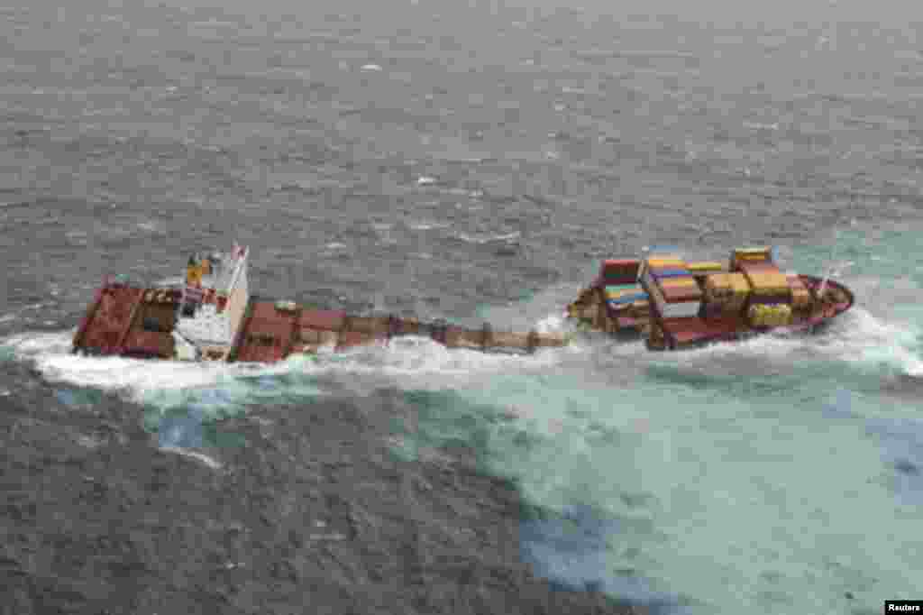 The stricken container ship Rena sits on a reef after it separated into two after being battered by waves the previous night, about 14 nautical miles (22 km) from Tauranga, on the east coast of New Zealand's North Island January 8, 2012.