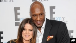 FILE - TV personality Khloe Kardashian Odom and professional basketball player Lamar Odom from the show "Keeping Up With The Kardashians" at an E! Network upfront event in New York, April 30, 2015.