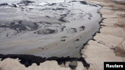A Shell tailings pond at its tar sands operations near Fort McMurray, Alberta, Sept. 17, 2014. 
